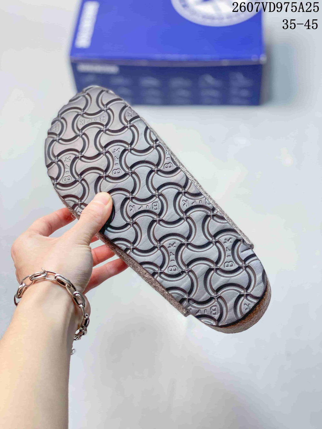 Close view of the molded outsole showing a repeating Birkenstock-pattern tread.