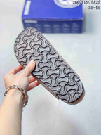 Close view of the molded outsole showing a repeating Birkenstock-pattern tread.