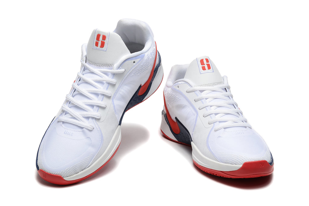 Front view of white Nike Sabrina 1 basketball shoes with red and navy details