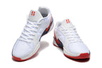 Front view of white Nike Sabrina 1 basketball shoes with red and navy details