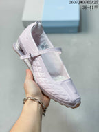 Angled side view showing the front strap, embossed side details and heel structure.