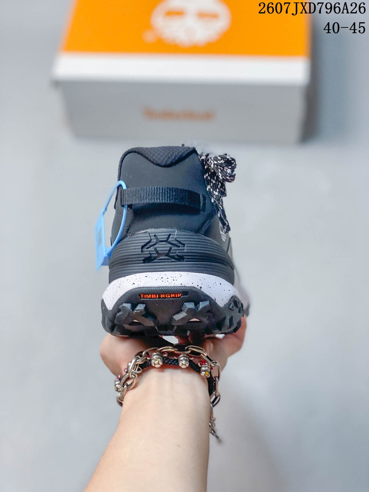 Rear view showing the padded heel, layered midsole, lugged outsole, and TIMB GRIP marking.