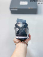 Rear view showing the heel construction, black and silver panels, and speckled midsole.
