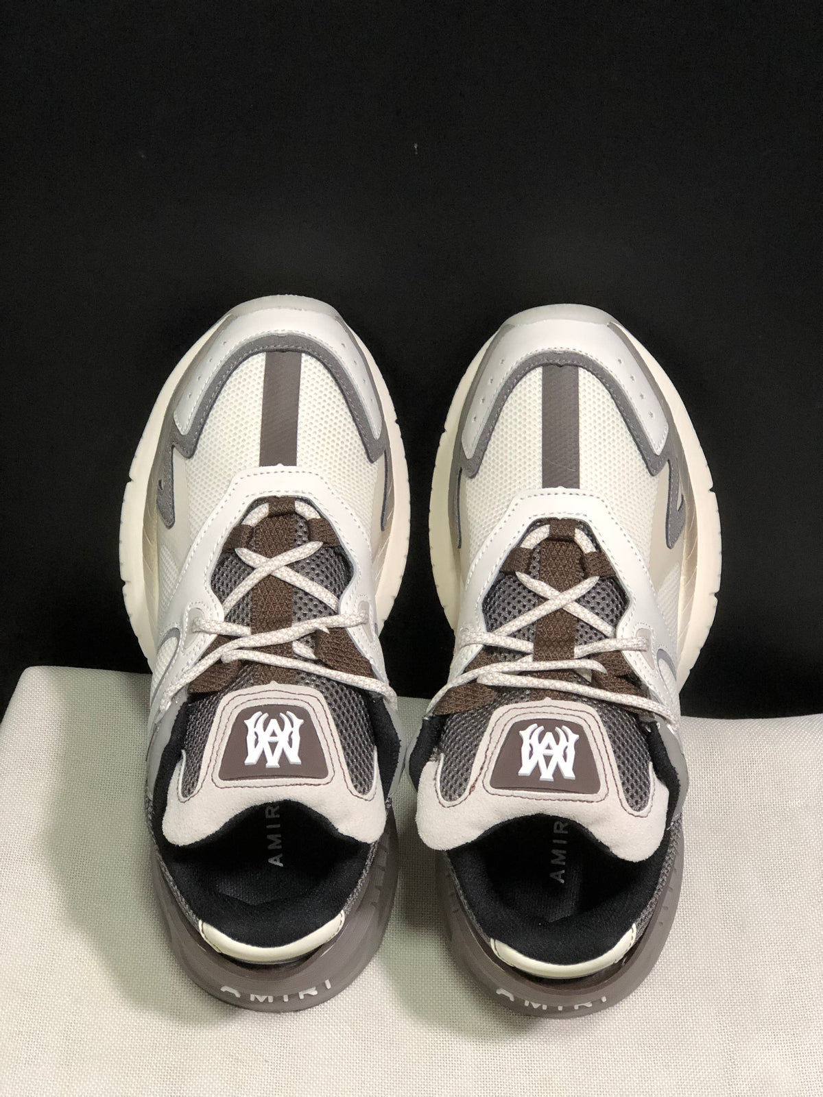 Top view showing the lace-up construction, padded tongues and contrasting grey details.