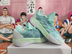 Pair of mint-green basketball sneakers shown from the side, with red accents and sculpted soles.