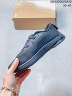 Side profile of a dark navy On Cloudnova Moon sneaker.