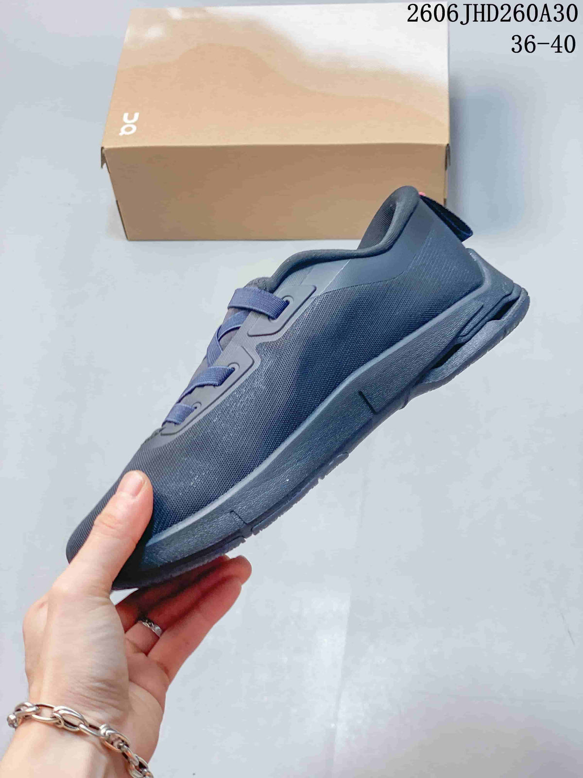 Side profile of a dark navy On Cloudnova Moon sneaker.