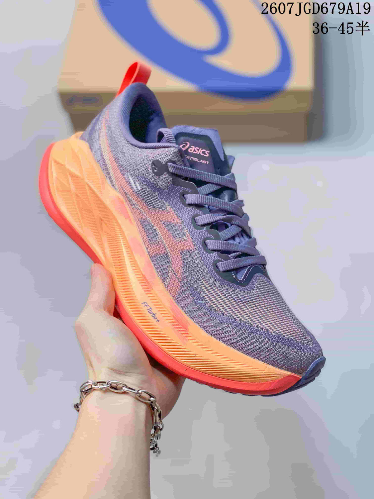 Dark blue and purple ASICS SUPERBLAST 2 running shoe with orange and red outsole accents, shown from a front three-quarter angle.