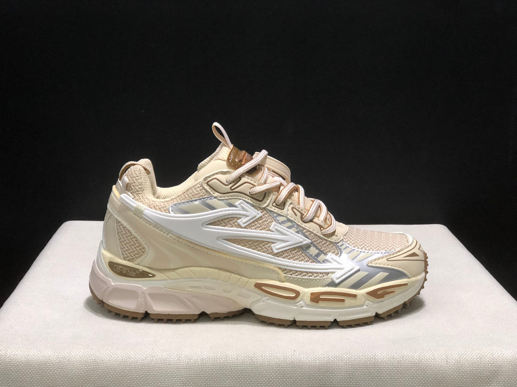 Single side profile of the cream OFF-WHITE Be Right Back sneaker against a dark background.
