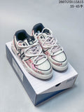 Pair of white and pale pink MLB sneakers with distressed graffiti graphics displayed on a branded shoe box.