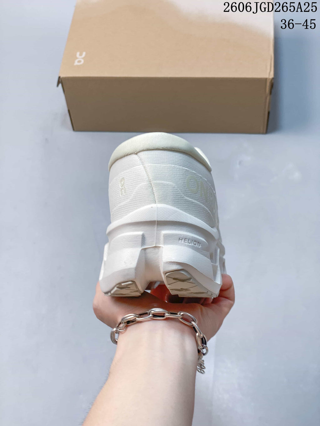 Rear view showing the heel and sculpted sole of the white shoe