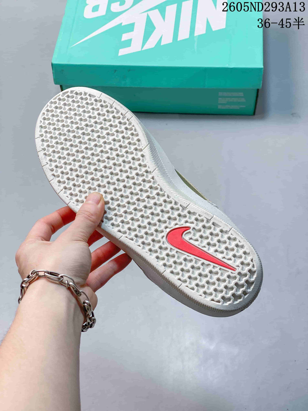 Close view of the textured honeycomb-pattern rubber outsole with a contrasting Nike detail.