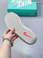 Close view of the textured honeycomb-pattern rubber outsole with a contrasting Nike detail.