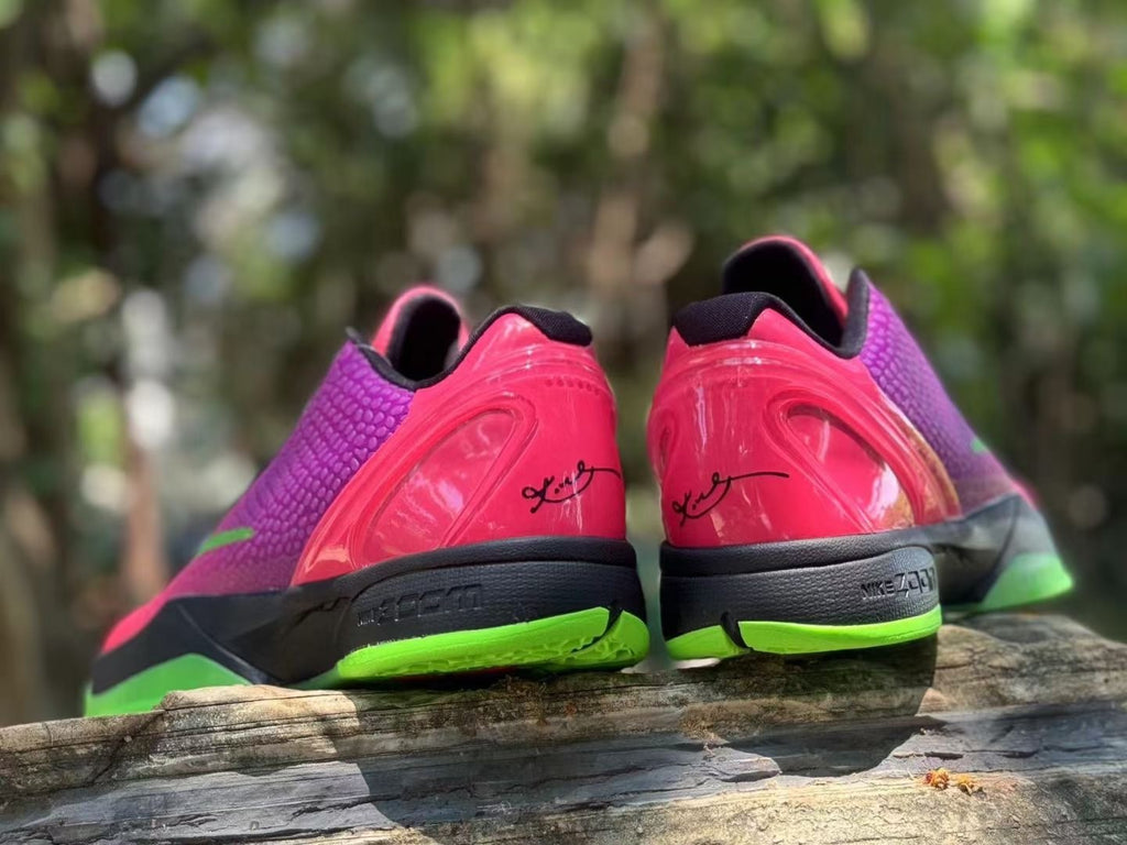 Rear view showing pink heel panels and black midsole details