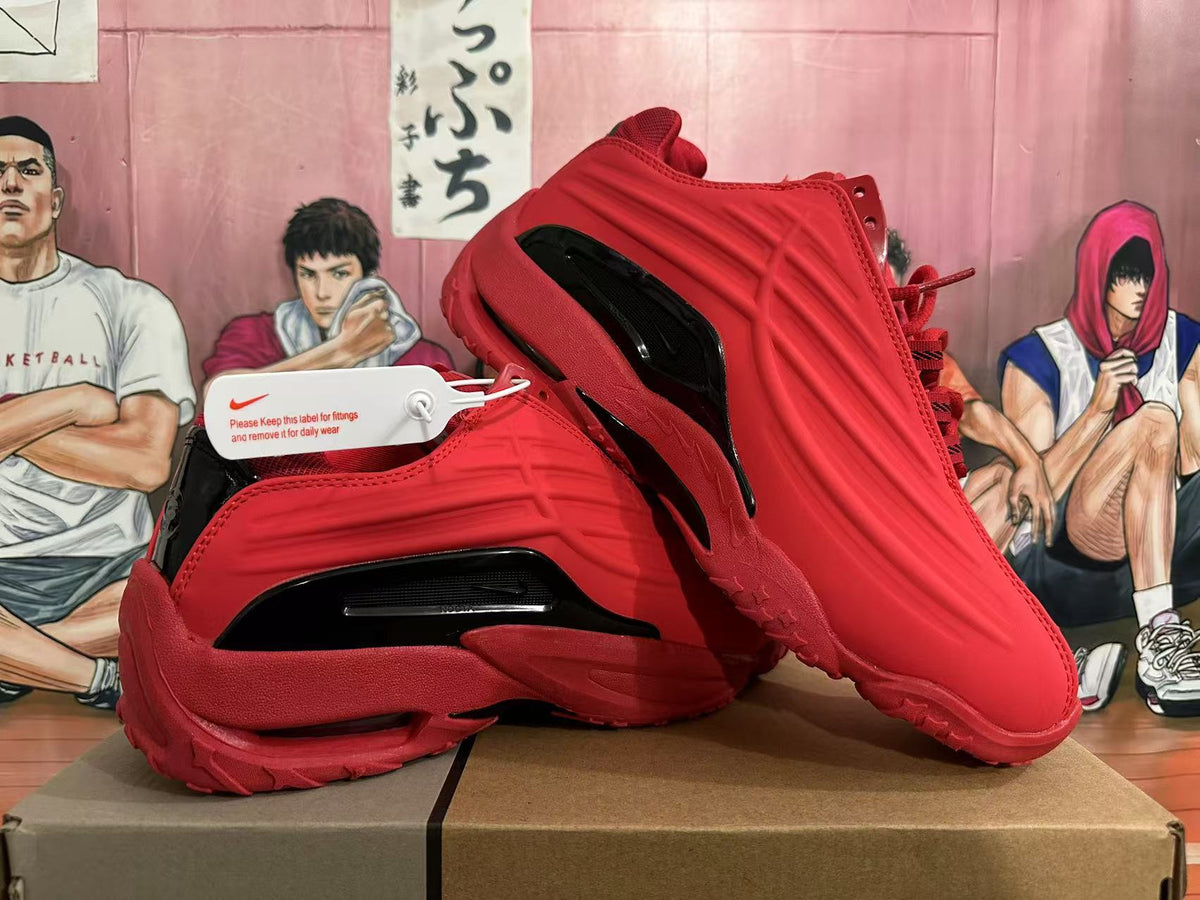 Pair of red Nike basketball shoes with sculpted side panels and black accents