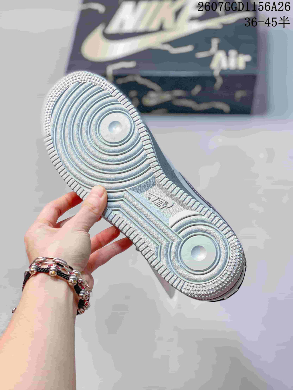 Close-up of the textured rubber outsole showing circular traction areas and perimeter tread.