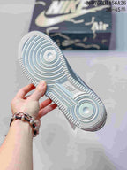 Close-up of the textured rubber outsole showing circular traction areas and perimeter tread.