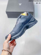 Side profile of the KAILAS hiking shoe showing layered panels, a protective heel structure and aggressive outsole tread.