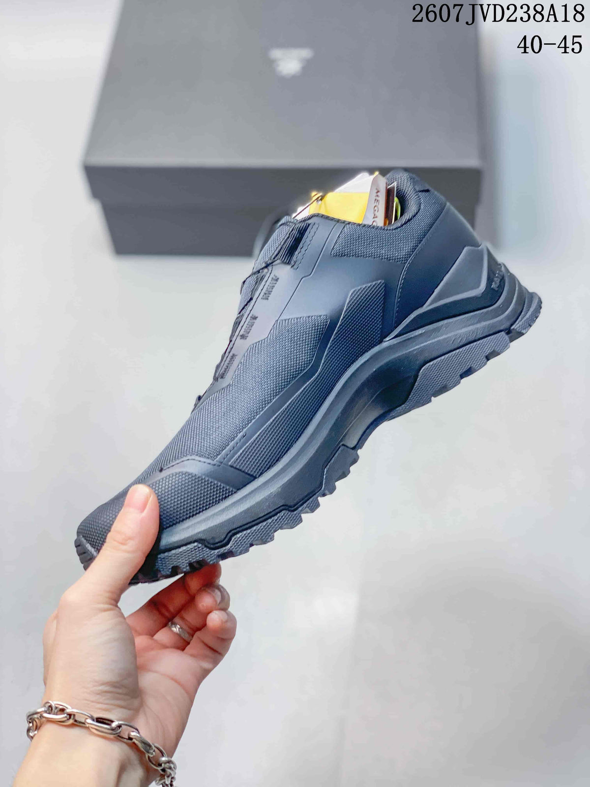 Side profile of the KAILAS hiking shoe showing layered panels, a protective heel structure and aggressive outsole tread.