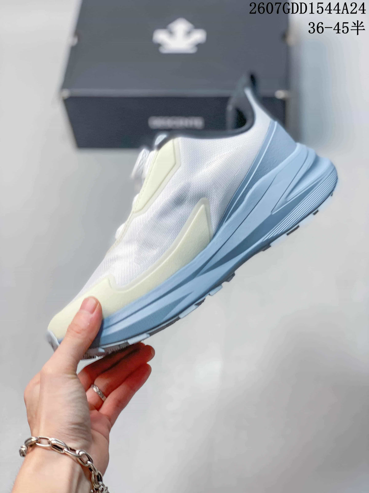 Side profile showing the white upper, pale yellow accents, light blue midsole, and textured outsole.