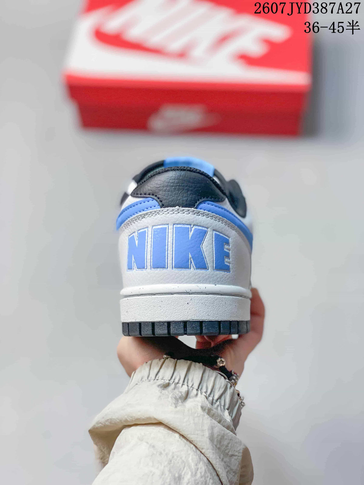 Rear view showing the blue-accented heel and large Nike lettering.