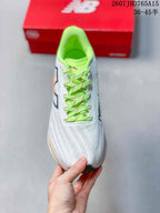 Top view of the running shoe showing the white mesh upper, lime-green laces, and padded collar.
