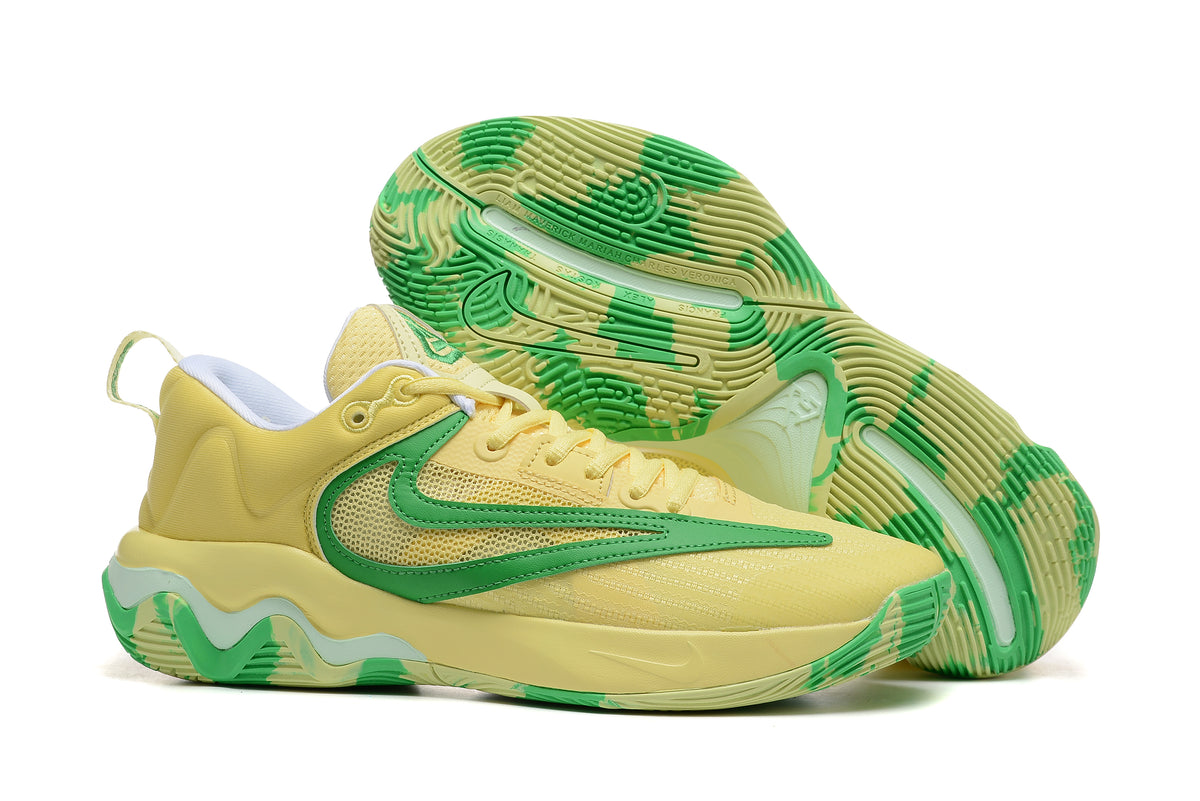 Yellow basketball shoe with green accents and patterned outsole