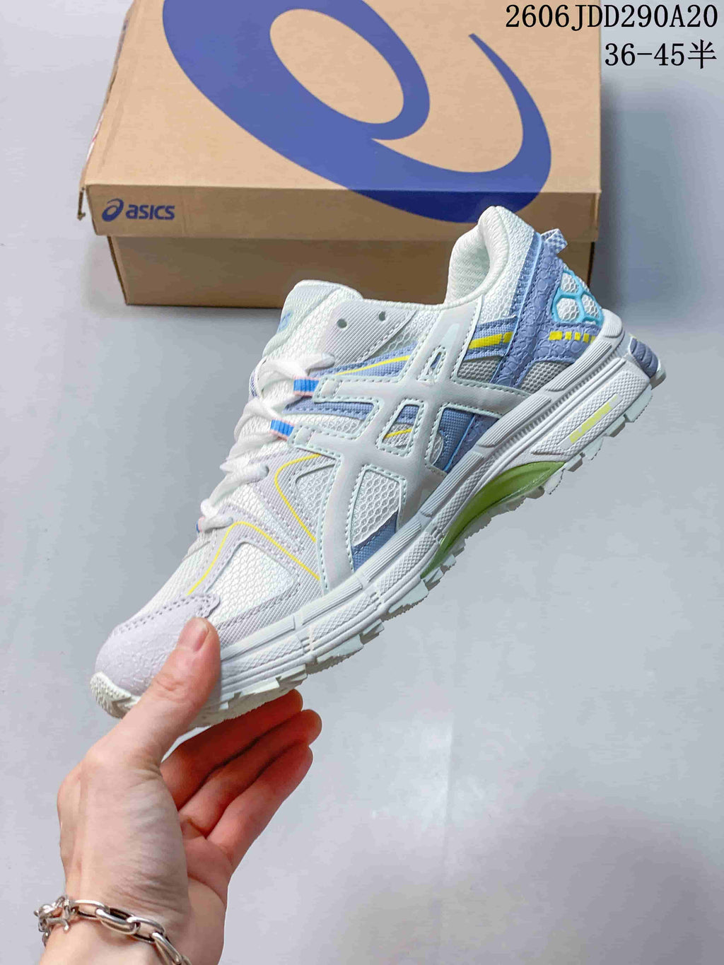Side view of the white sneaker highlighting the structured ASICS side branding and multicolor accents.