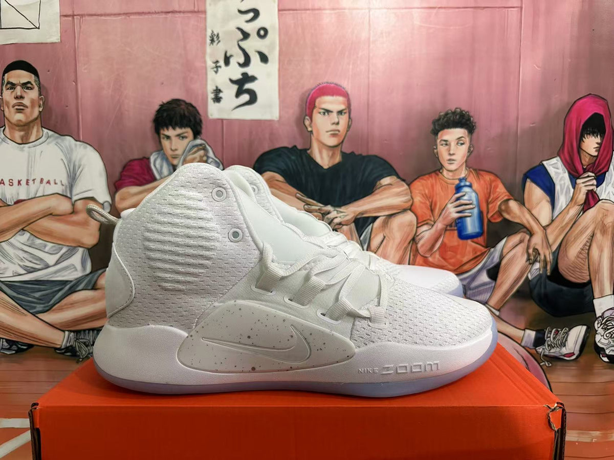 Side view of a white and silver Nike high-top basketball shoe with Zoom branding