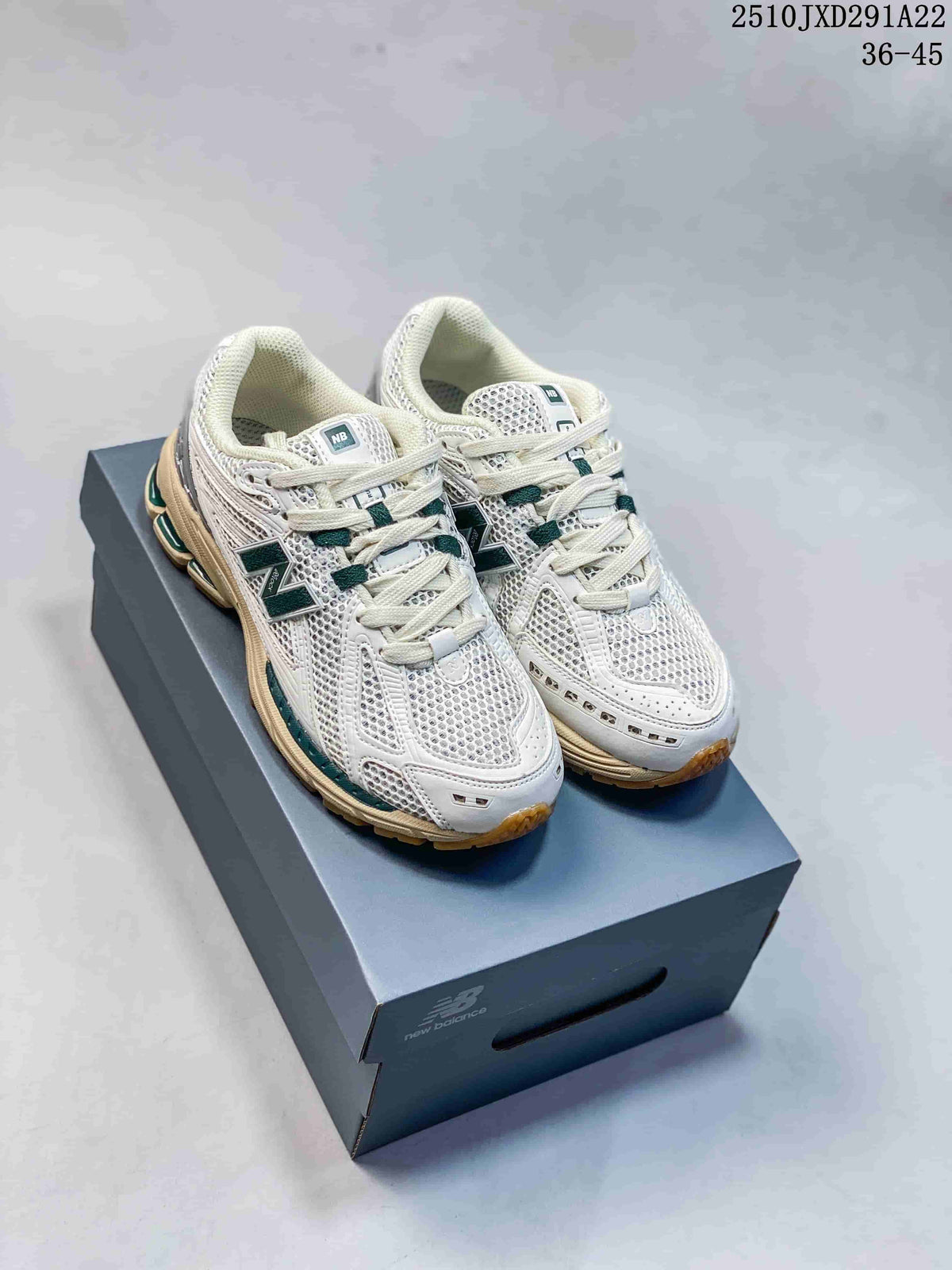 Pair of New Balance 1906AD sneakers in gray, silver, dark green, and cream, displayed on a shoebox; image also shows the printed size range 36–45.
