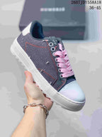 Dark navy NUMERIS low-top sneaker with pink laces, red stitching and a white toe cap; image shows size range 36-45.