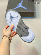 Translucent outsole viewed from below, showing a herringbone-style traction pattern and dark central section.