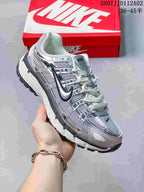 Angled side view of a silver-toned Nike P-6000 sneaker