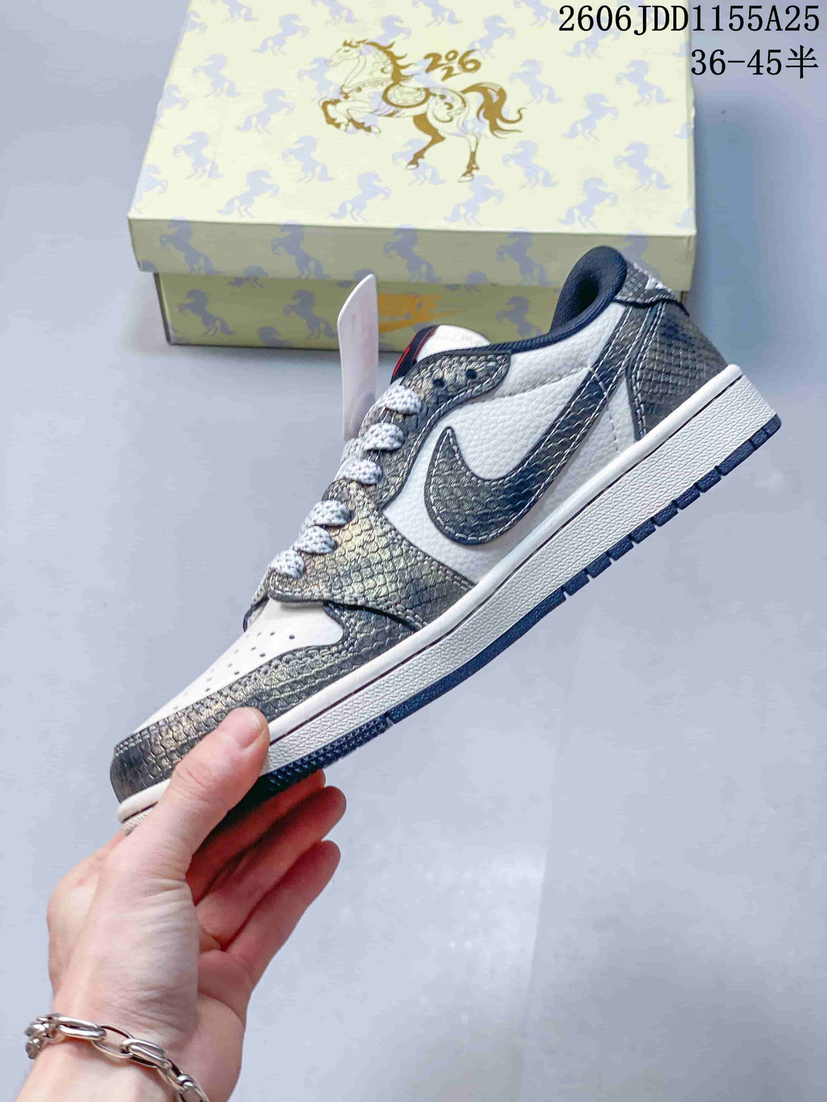 Side profile showing the low-top shape, patterned overlays, side logo, white midsole, and dark outsole.