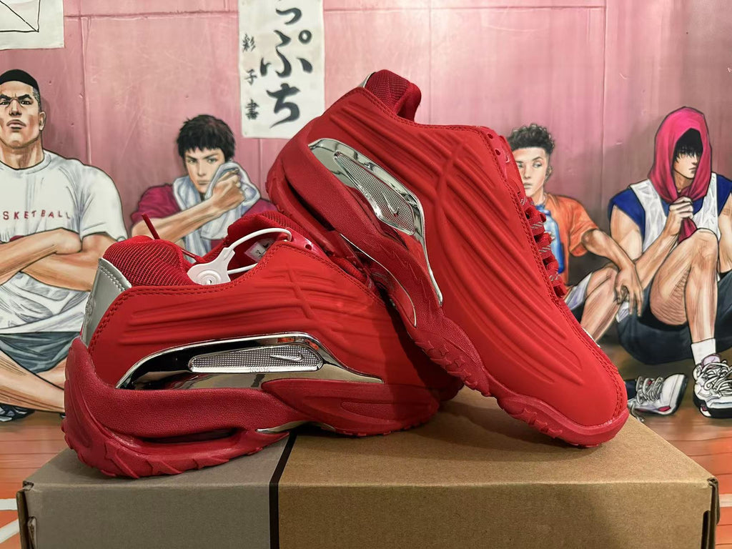 Red sneakers displayed from side and top angles, showing the tread and silver-toned details.
