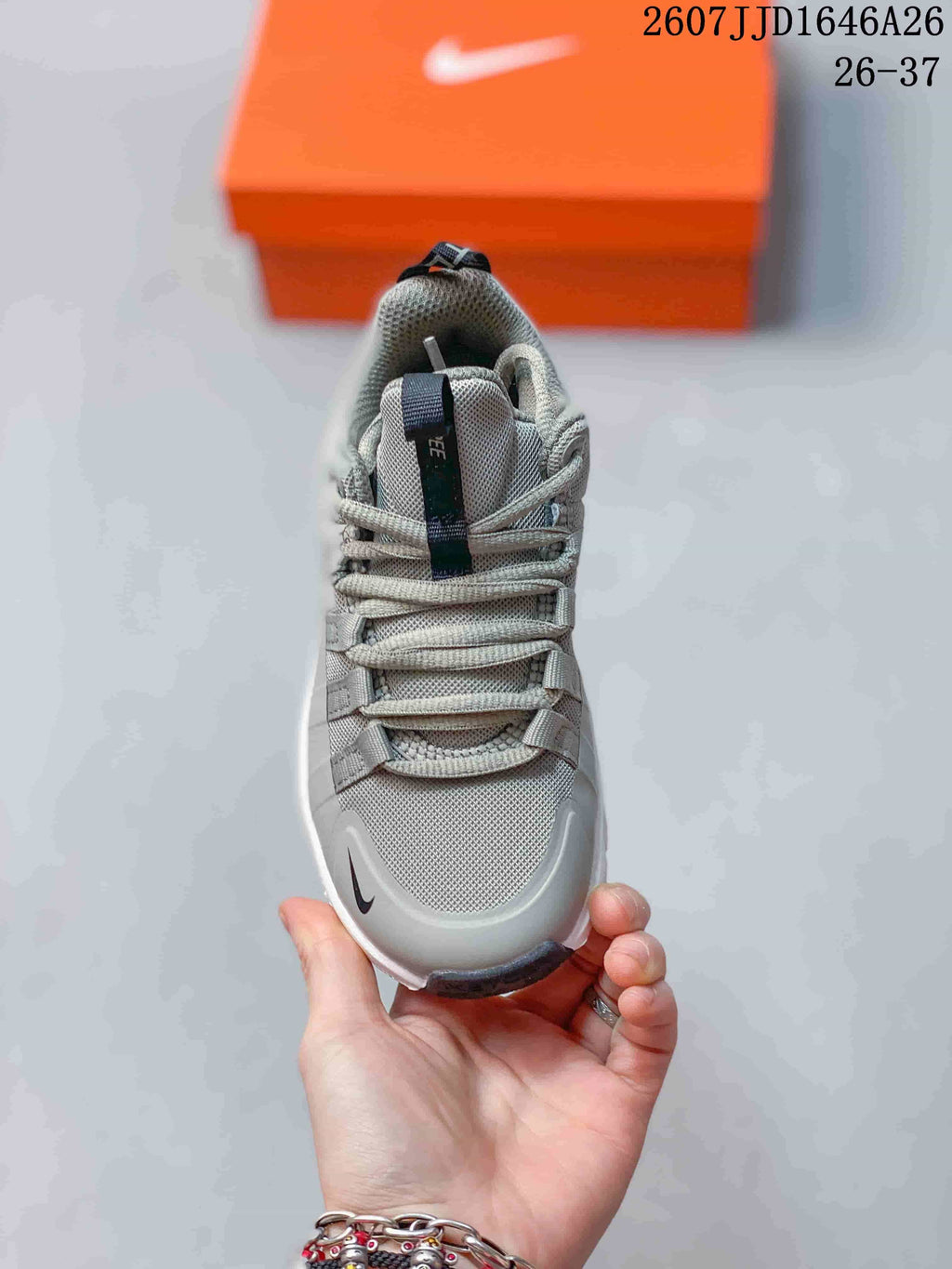 Top view showing the laces, tongue, textured upper, and toe branding of the children's sneaker.