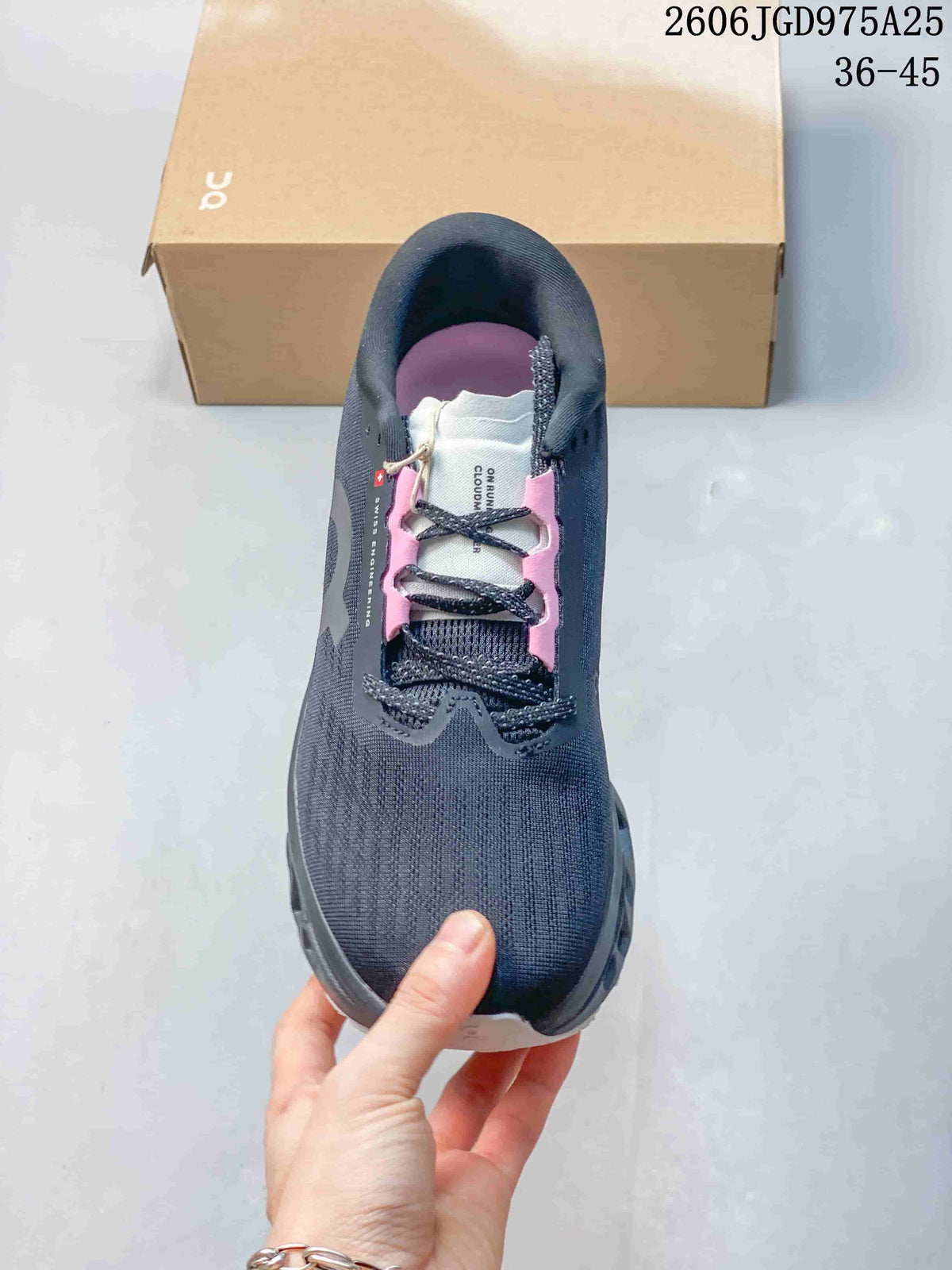 Top view showing the lace-up design and pink accents on a charcoal running shoe.