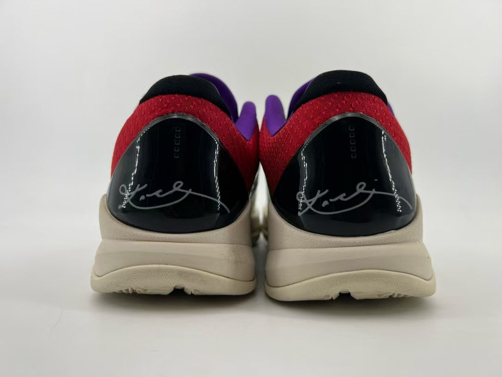 Rear view of the pair showing black heel panels and red collars