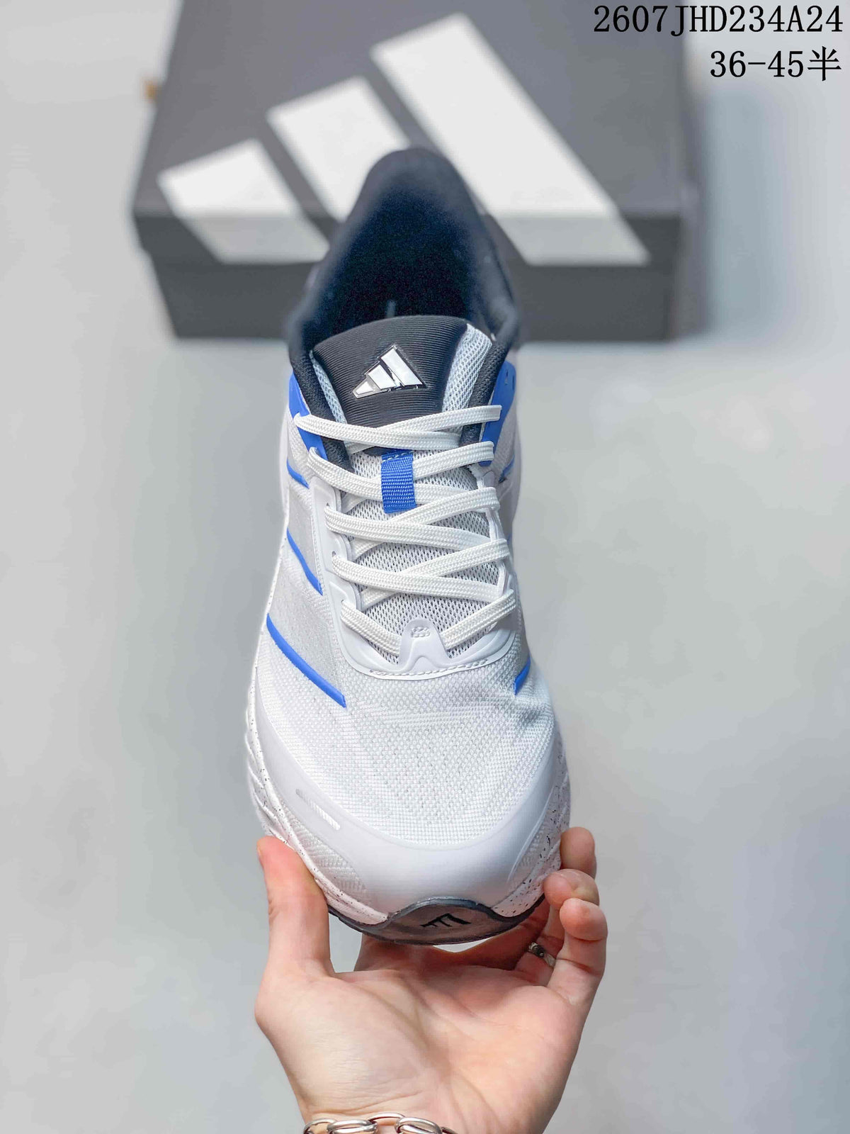 Front view showing white laces, mesh-style tongue, blue details and adidas tongue branding.