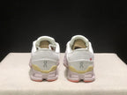 Rear view of the pair showing the On logos, padded collars, and yellow heel details.