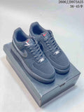 Pair of black Nike Air Force 1 low-top sneakers displayed on a shoe box, with style code JD975A25 and size range text visible above.