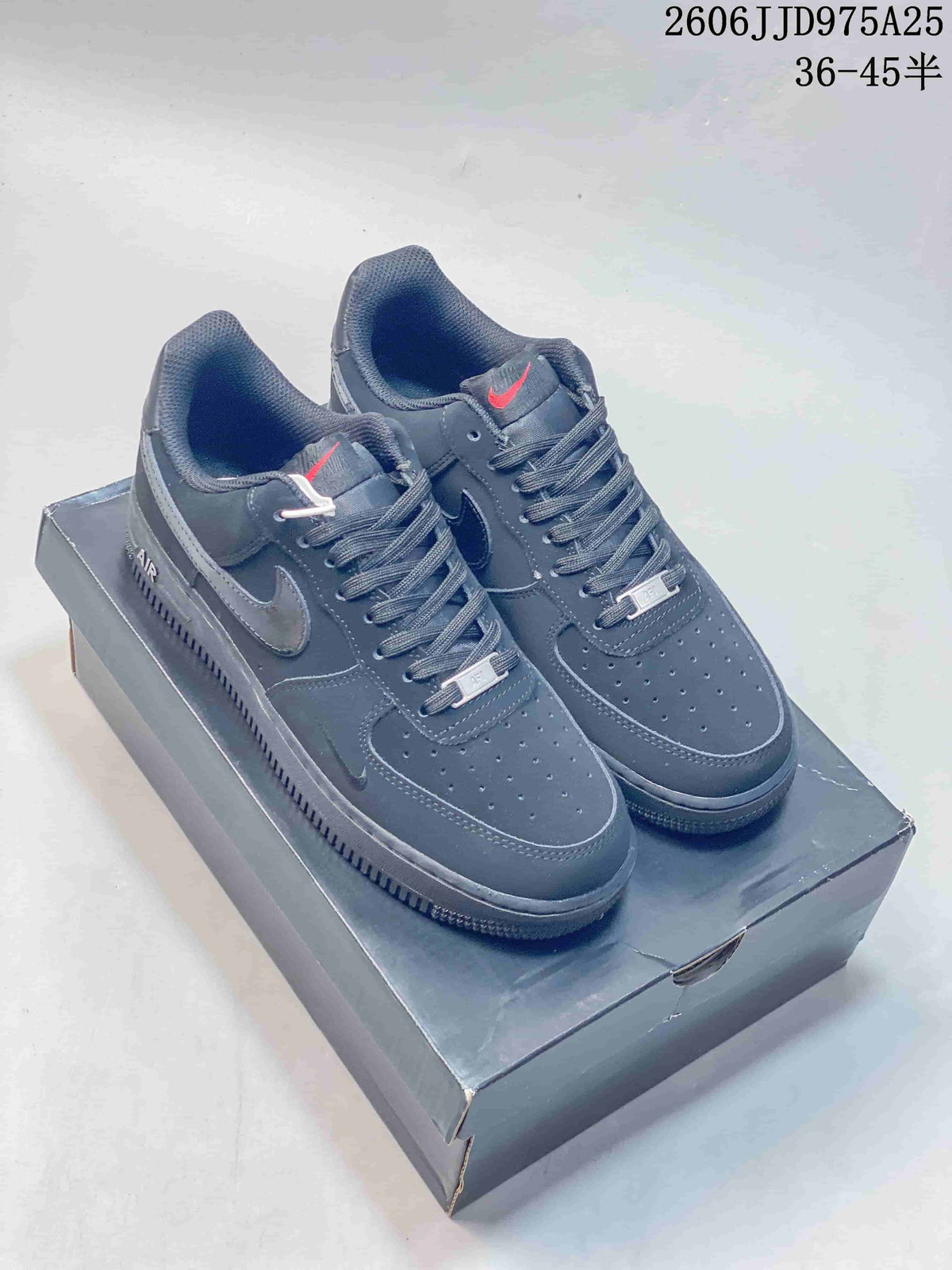 Pair of black Nike Air Force 1 low-top sneakers displayed on a shoe box, with style code JD975A25 and size range text visible above.