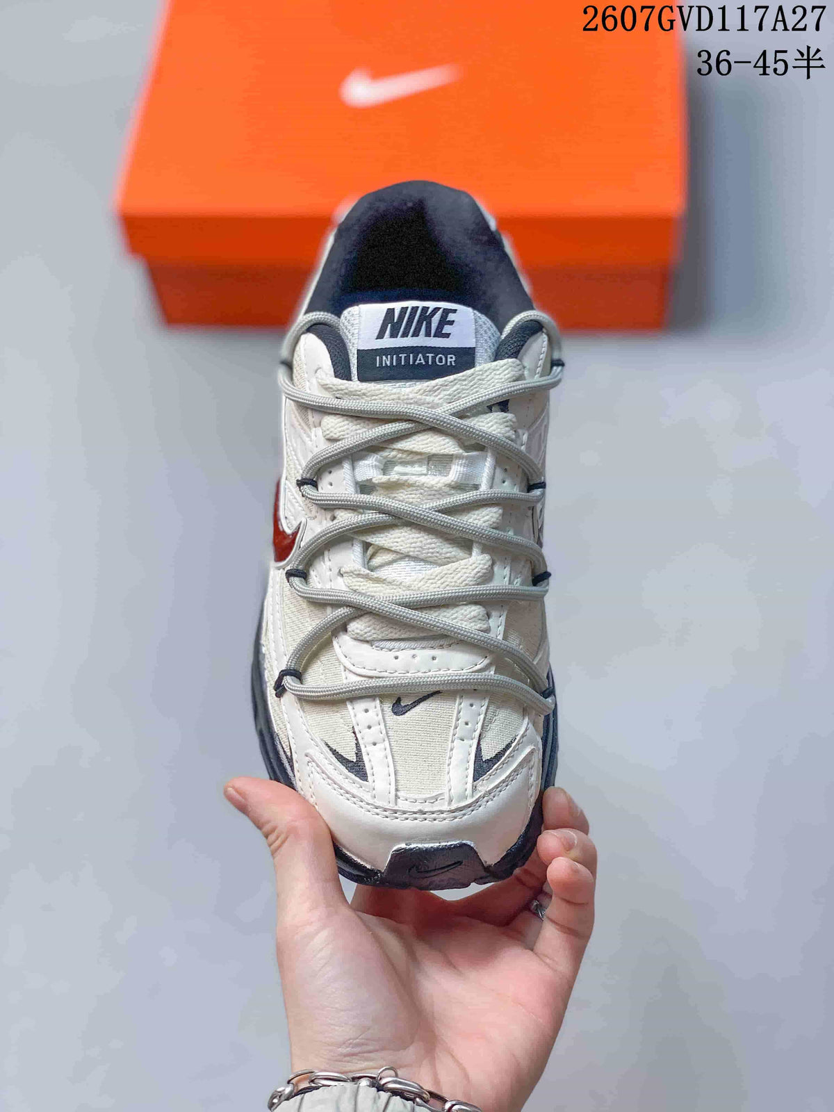 Top view of the sneaker showing the lace arrangement, layered toe panels and Nike Initiator tongue label.