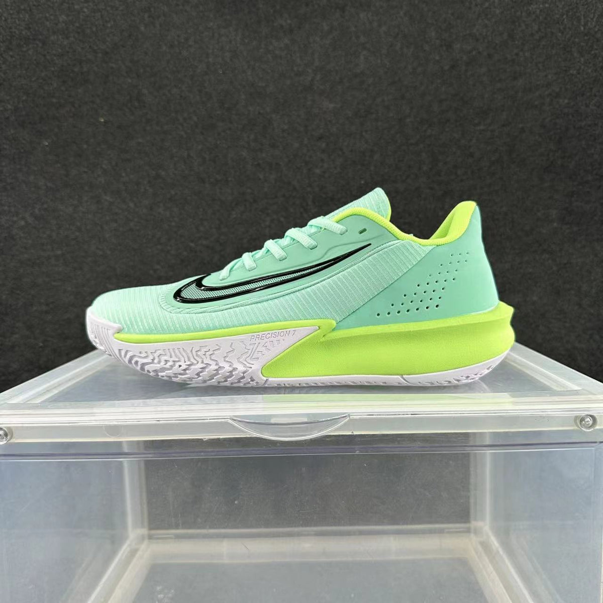 Side view of a mint green Nike Precision 7 basketball shoe with white and bright lime accents.