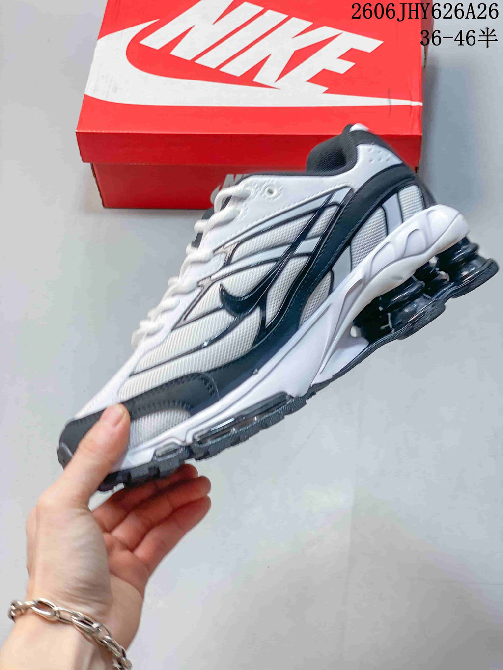 Side view of the white and dark gray Nike Shox Ride 2 sneaker