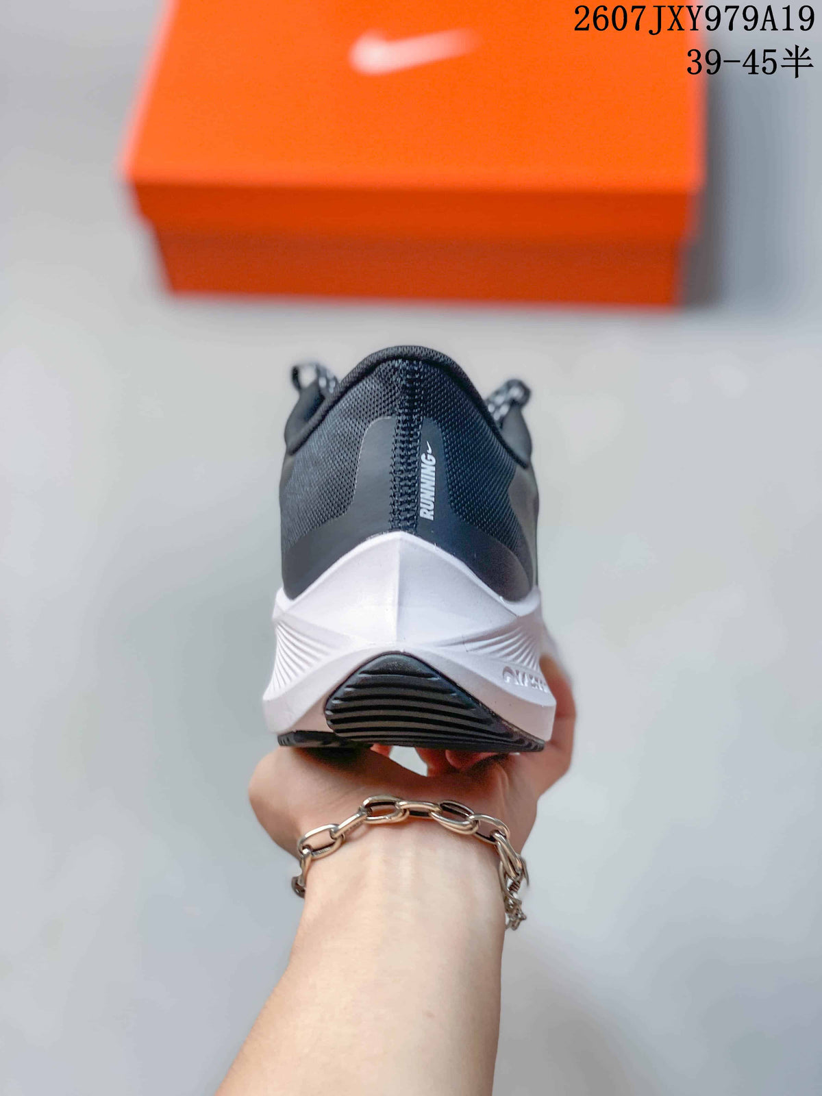 Rear view showing the padded heel, white midsole, and black outsole.