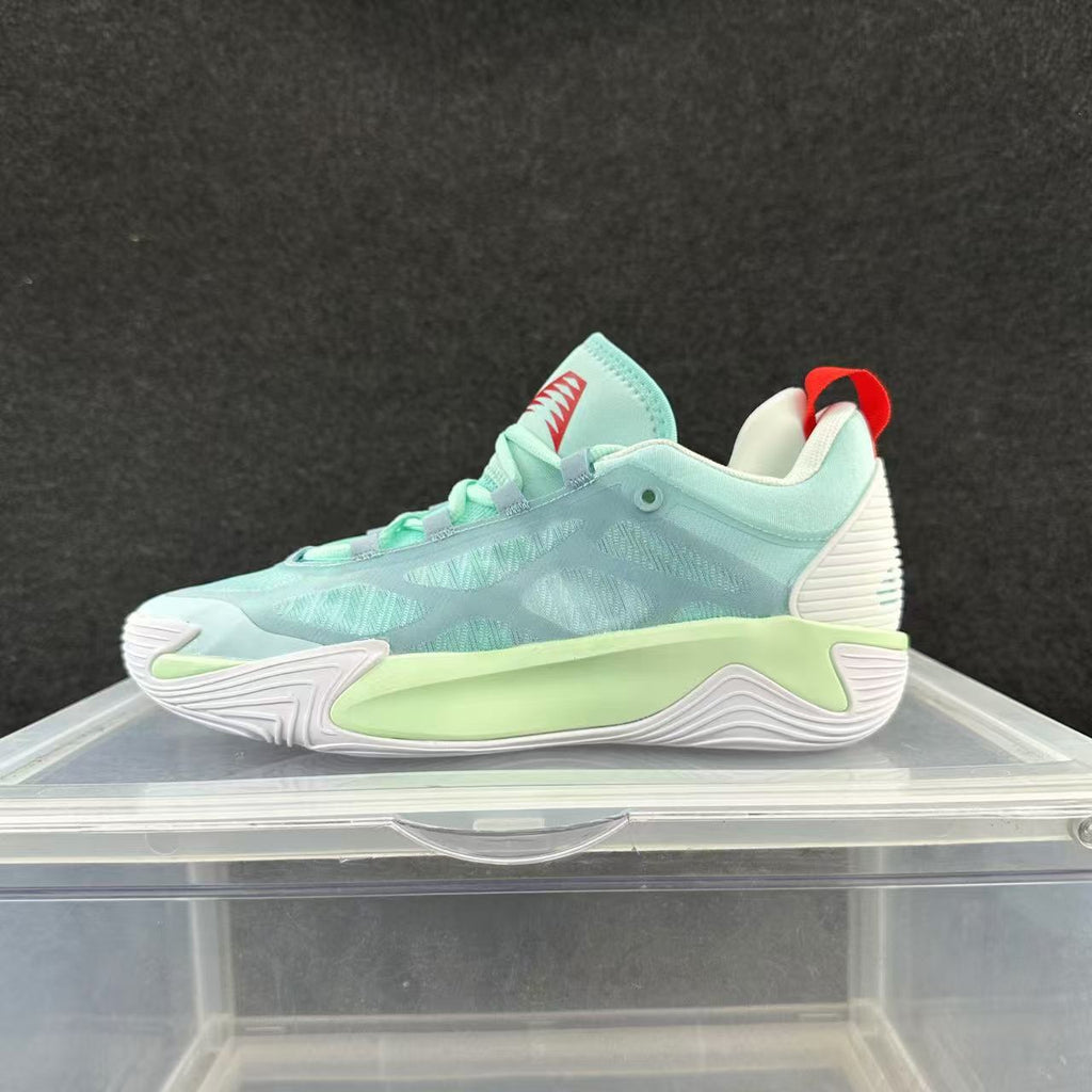 Mint green and pale aqua low-top basketball shoe with a white sole