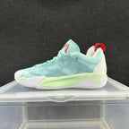 Mint green and pale aqua low-top basketball shoe with a white sole
