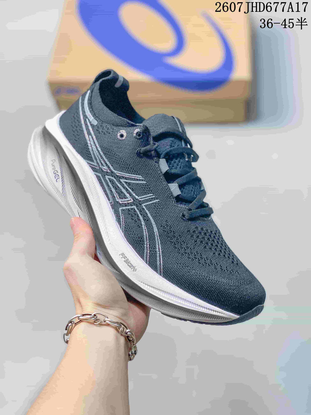 Dark charcoal ASICS Gel-Nimbus 26 sneaker with a textile-style upper, white midsole, and contrasting outlined side logo.