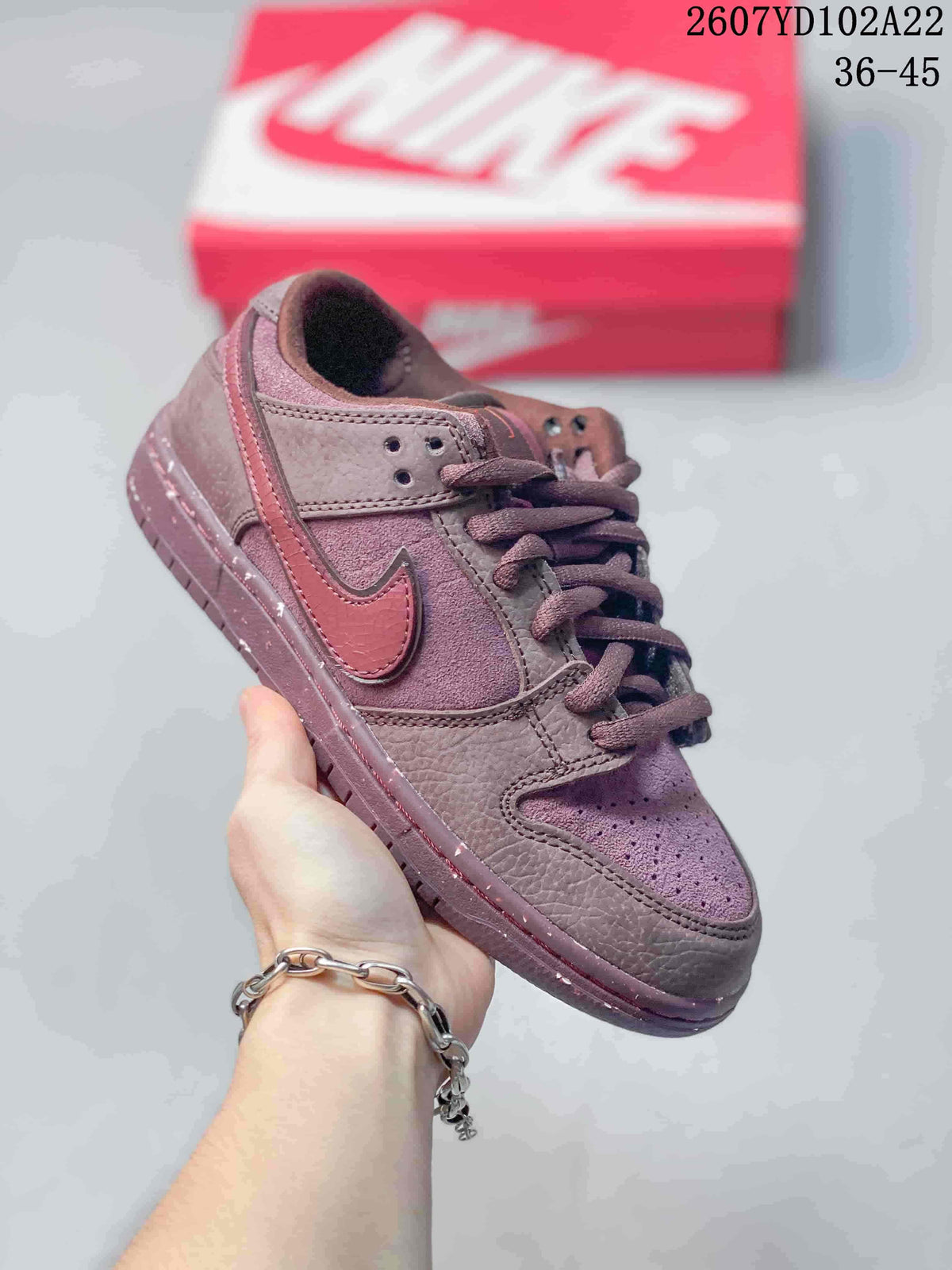 Burgundy Nike SB Dunk Low Pro sneaker with matching laces, Swoosh and outsole.